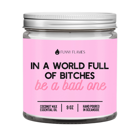Candle jar with pink label featuring humorous text and 'Funny Flames' branding.